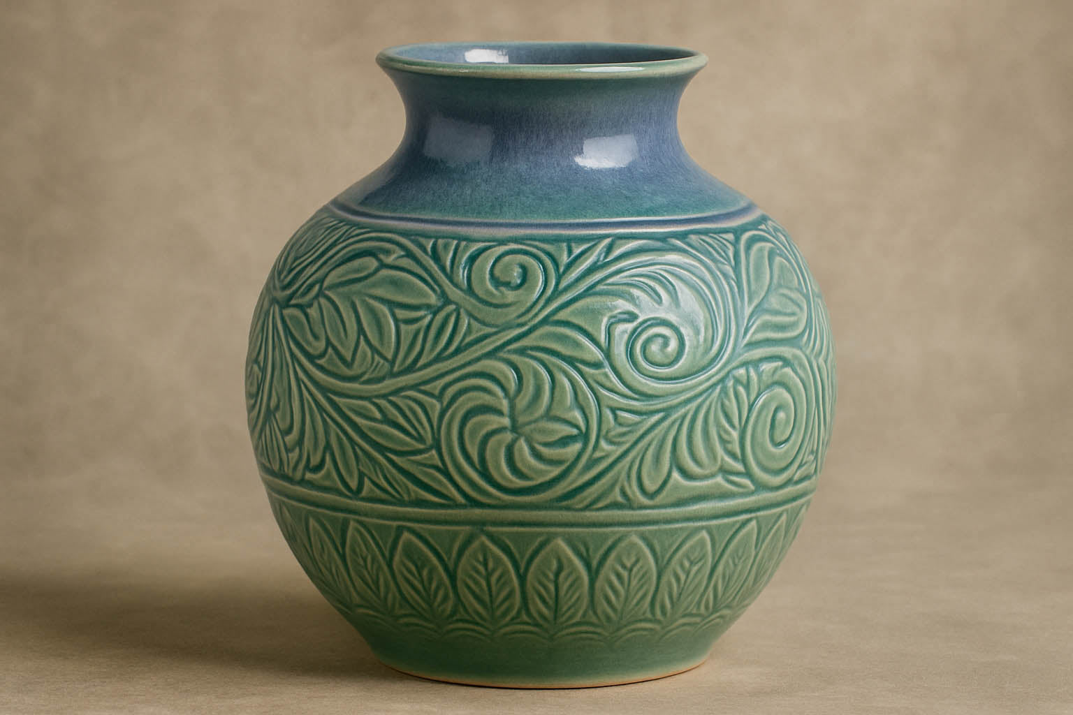 Textured ceramic vase showcasing celadon glaze pooling into carvings