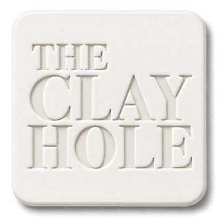 White Laguna #16 Porcelain cone 6 clay tile, unglazed, stamped with The Clay Hole logo