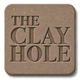 Tan Laguna 52 Buff clay tile, unglazed, stamped with The Clay Hole logo