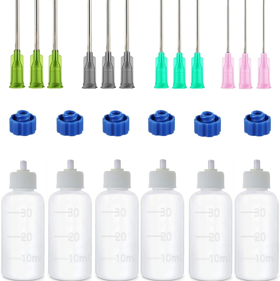 Six 30 ml plastic applicator bottles laid out with twelve colored blunt needle tips and six blue sealing caps
