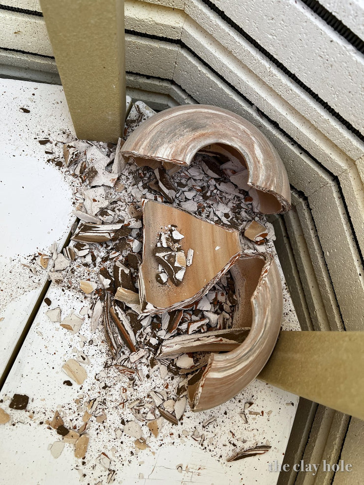Marbled agateware bowl shattered into shards inside the kiln