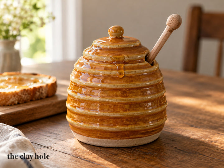 A Beehive Honey Pot made from The Clay Hole paper template 32: a honey pot shaped like a straw skep, with coil ridges and a notched lid for the dipper