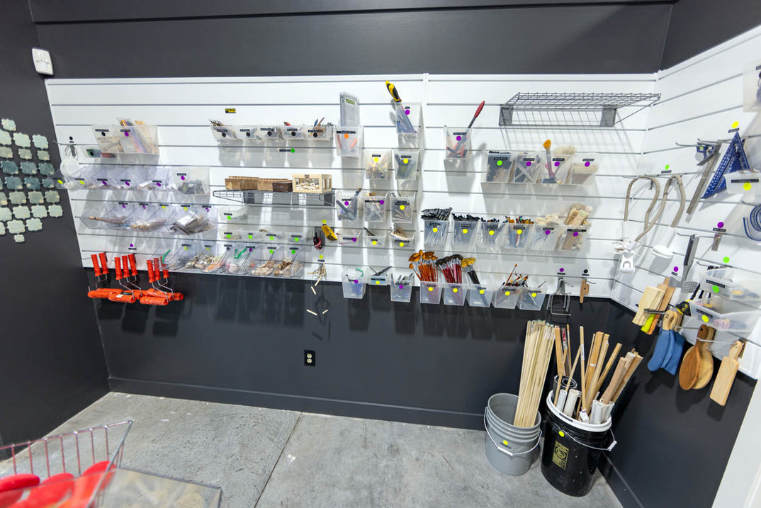 Further tool storage running along a studio wall.