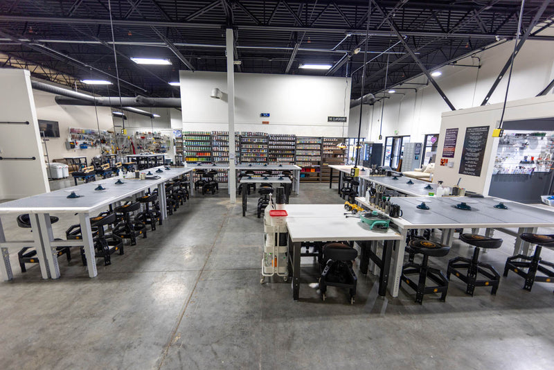 Open floor space and worktables across the Clay Hole studio