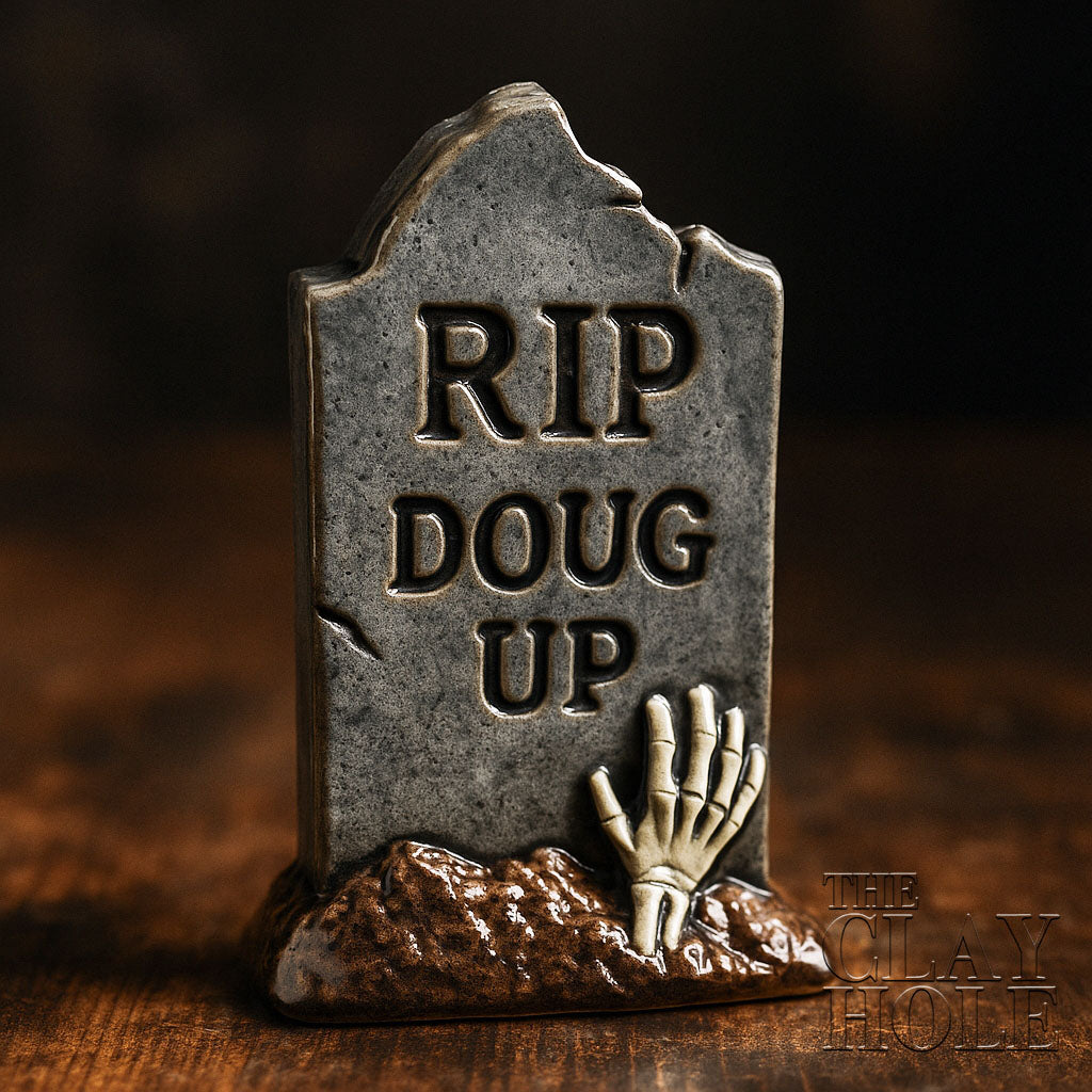A ceramic tombstone made in a pottery and ceramic class