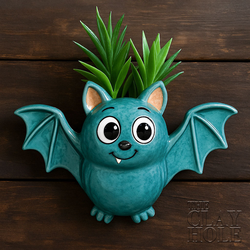 A hanging bat planter made in a pottery and ceramic class
