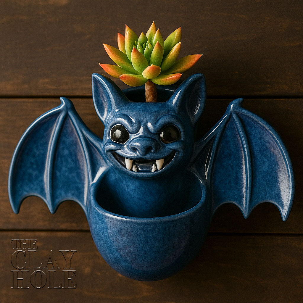 A hanging bat planter made in a pottery and ceramic class