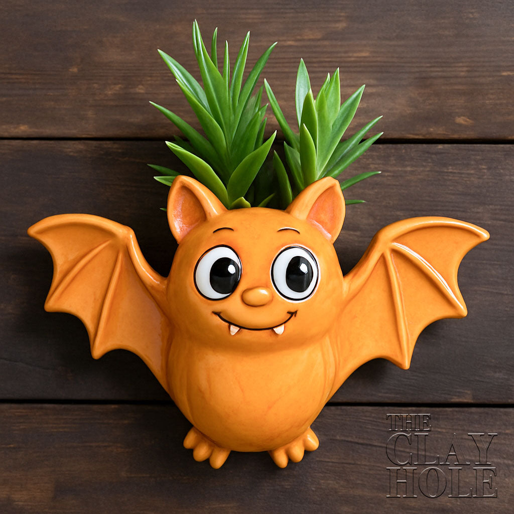 A hanging bat planter made in a pottery and ceramic class