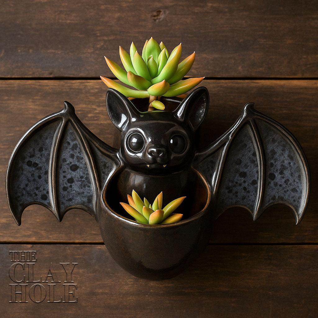 A hanging bat planter made in a pottery and ceramic class