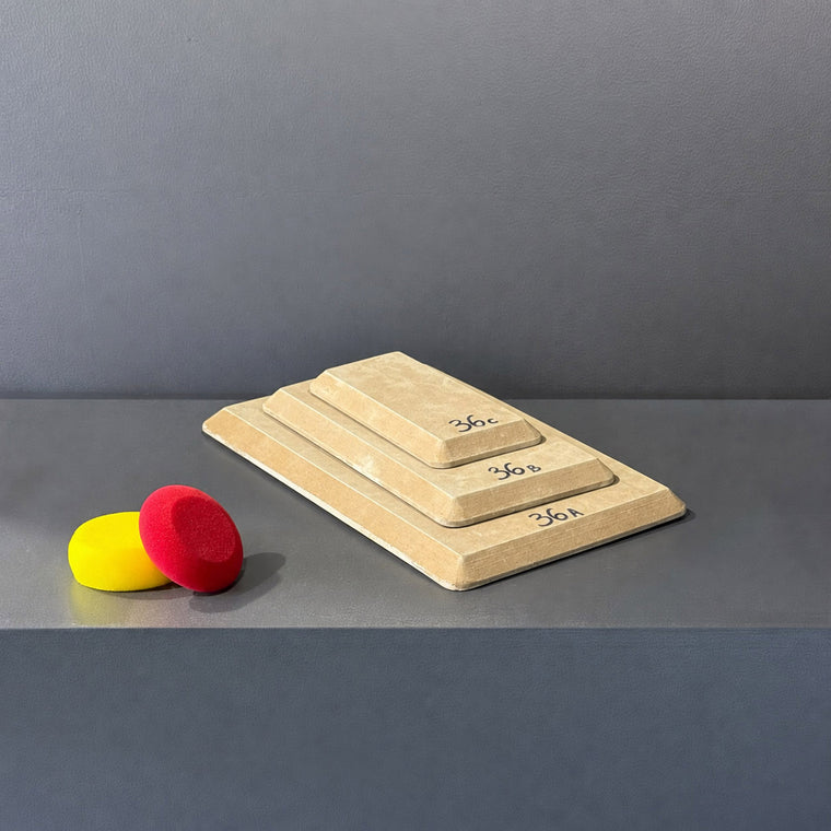 High-density fiberboard mold 36A: a rectangular board, the largest of a 3-piece nesting set shown stacked largest to smallest on the gray shelf, hand-labeled 36A.