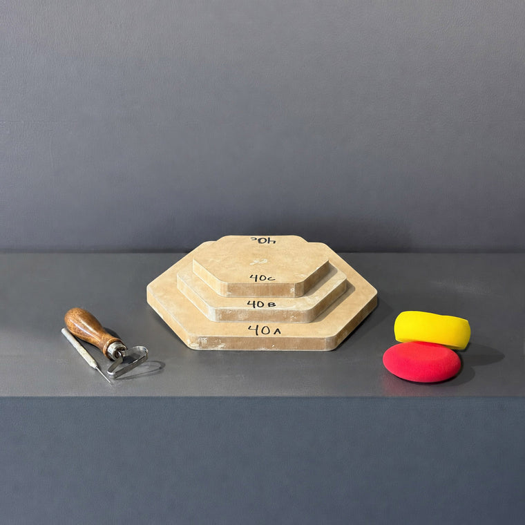 High-density fiberboard mold 40A: a flat octagonal board, the largest of a 3-piece nesting set shown stacked largest to smallest on the gray shelf, hand-labeled 40A.