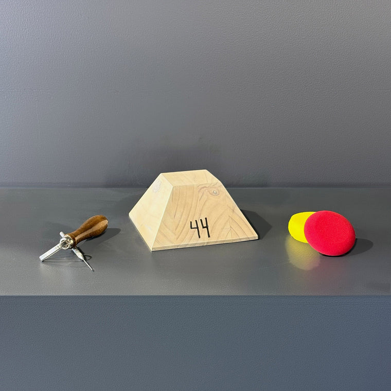 Unfinished light pine mold number 44: a solid wooden truncated pyramid, measuring 6.25 in wide, 6.3 in deep and 3.25 in tall with flat angled faces, hand-numbered 44 on the front face.