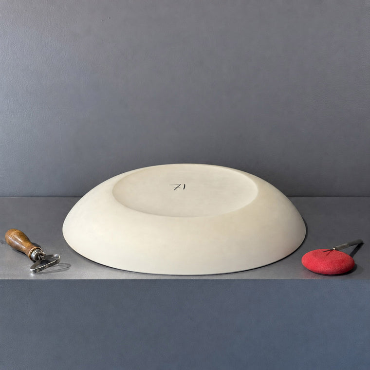 White pottery plaster mold number 71: a large oval plate mold, with a raised inner ring defining a flat well inside a broad rim.
