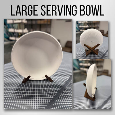 A round bisque-fired stoneware serving bowl with a ribbed exterior on a wooden stand