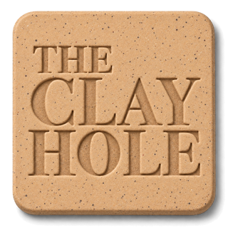 Tan Laguna Speckled Buff clay tile, unglazed, stamped with The Clay Hole logo
