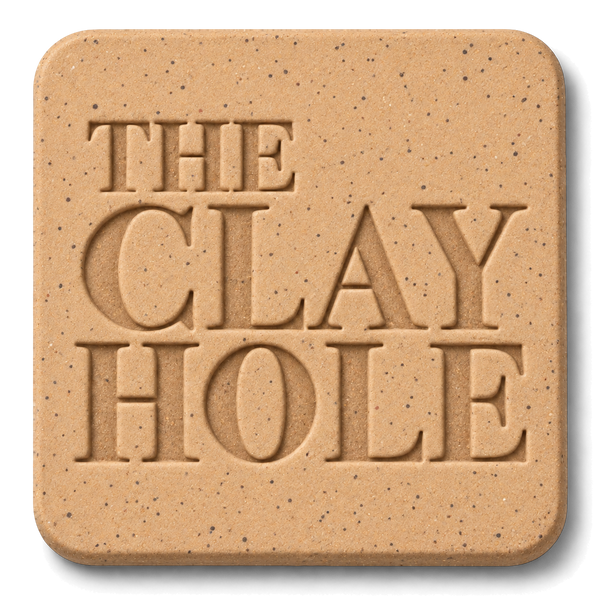Tan Laguna Speckled Buff clay tile, unglazed, stamped with The Clay Hole logo