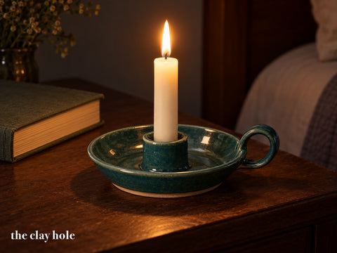 A Taper Chamberstick made from The Clay Hole paper template 33: a low carrying candle holder with a drip dish, a finger loop and a cup that fits a standard taper
